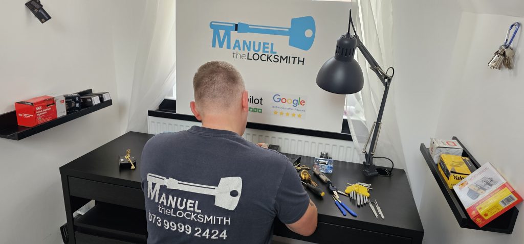 Professional locksmith repairing a damaged door lock